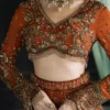 Detail shot Dabka Tilla Nakshi and 3D floral embroidery on burnt amber organza bridal lehenga choli — HBO Atelier