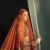 Burnt amber organza bridal lehenga with antique gold Dabka and Nakshi embroidery — Hammad Bespoke Official