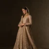 dusty-fawn-bridal-anarkali-sequin-lehenga-full-length-side-view-hammad-bespoke-official.webp fawn peshwas anarkali bridal dress gota embroidery nikkah Hammad Bespoke Official