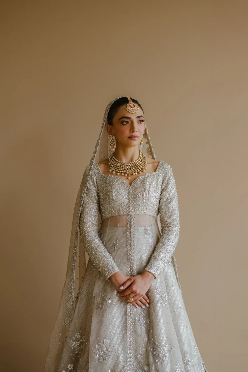 white-bridal-lehenga-ivory-silver-peshwas-zari-net-brocade-nikkah-full-length-hammad-bespoke-official.webp white bridal lehenga ivory silver peshwas zari net brocade nikkah full length Hammad Bespoke Official
