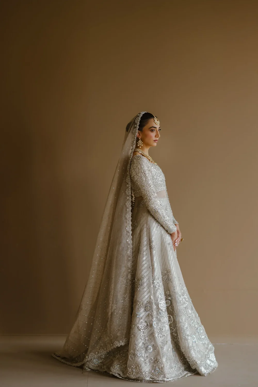 white-bridal-lehenga-silver-peshwas-brocade-lehenga-zari-net-nikkah-bespoke-hammad-bespoke-official.webp white bridal lehenga silver peshwas brocade lehenga zari net nikkah bespoke Hammad Bespoke Official