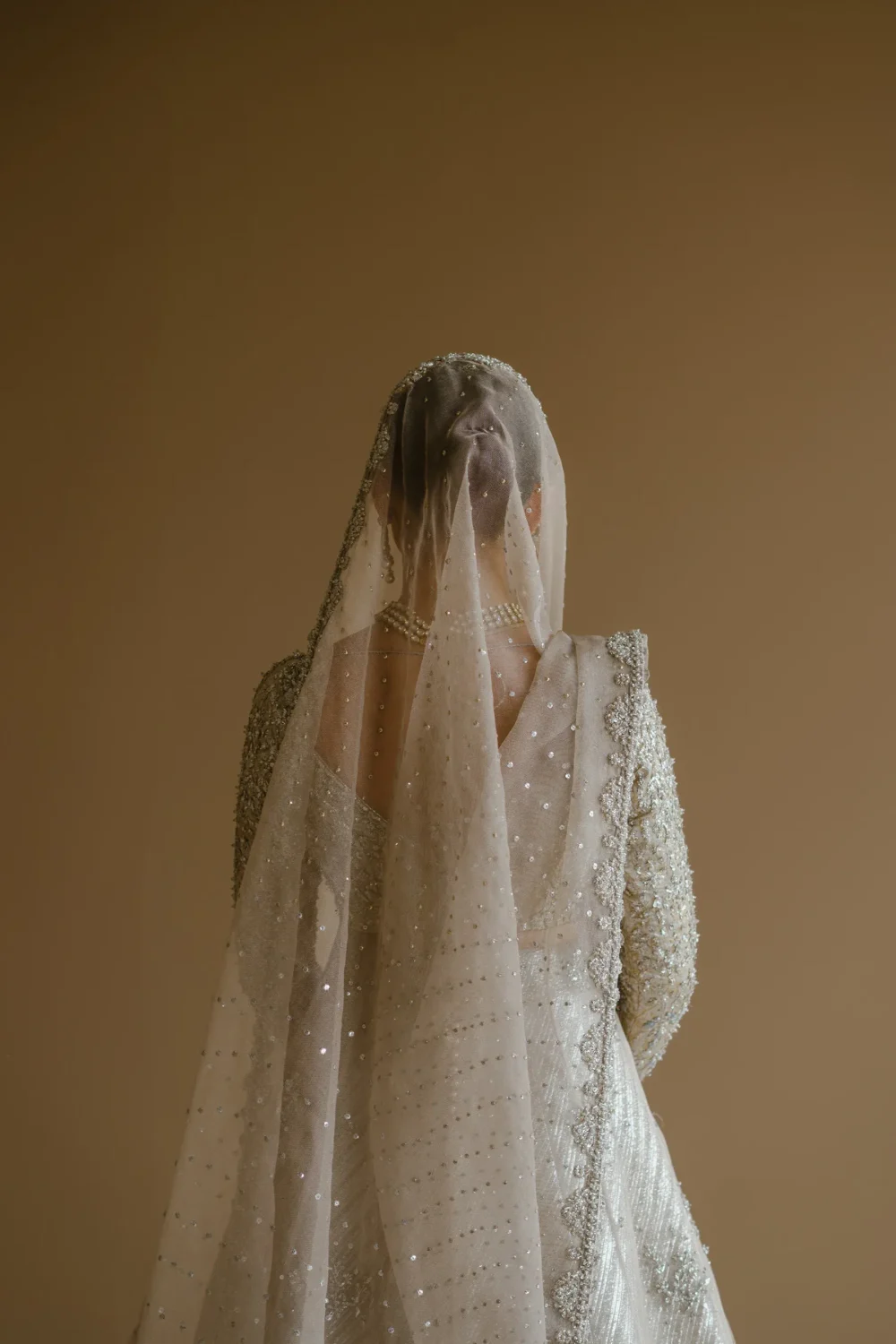 white-bridal-lehenga-ivory-silver-peshwas-zari-net-brocade-nikkah-full-length-hammad-bespoke-official.webp white bridal lehenga ivory silver peshwas zari net brocade nikkah full length Hammad Bespoke Official