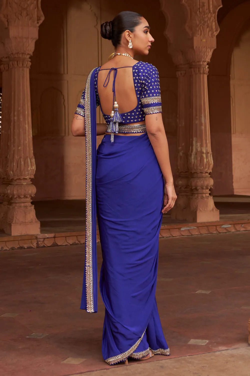 open-back-sequin-blouse-blue-saree-hammad-bespoke-official-hand-embroidered-crepe-pakistani.webp open-back sequin blouse blue saree Hammad Bespoke Official hand-embroidered crepe Pakistani