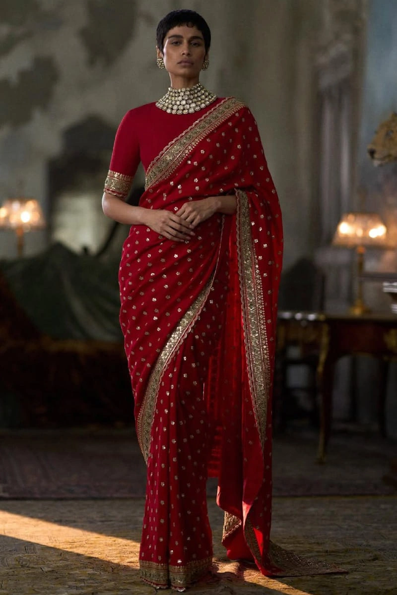 red-embroidered-georgette-saree-gold-border-scalloped-kaamdani-bootis-custom-blouse-hammad-bespoke-official.webp red embroidered georgette saree gold border scalloped kaamdani bootis custom blouse Hammad Bespoke Official