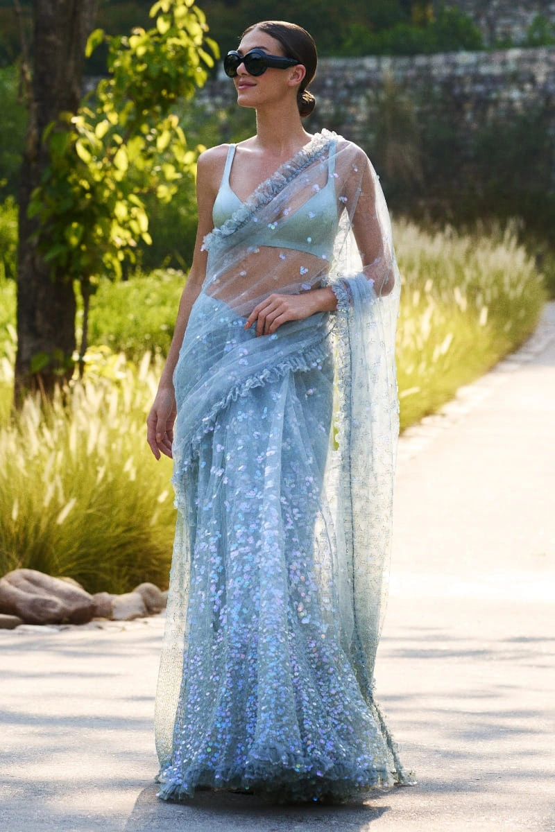 lehenga-saree-sky-blue-net-3d-floral-sequin-scatter-ruffled-border-custom-blouse-hammad-bespoke-official.webp lehenga saree sky blue net 3D floral sequin scatter ruffled border custom blouse Hammad Bespoke Official