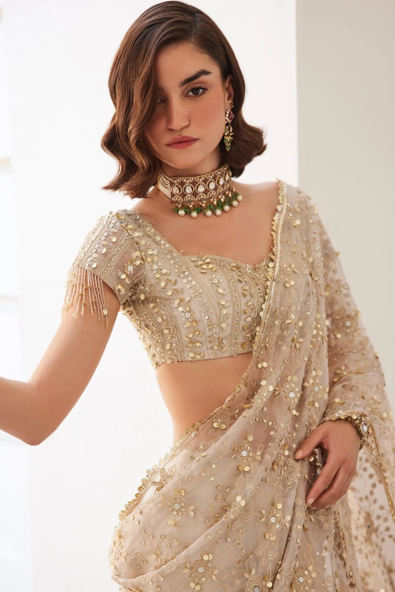 pre-draped-saree-champagne-ivory-sequin-embellishment-sweetheart-blouse-hammad-bespoke-official.webp pre draped saree champagne ivory sequin embellishment sweetheart blouse Hammad Bespoke Official