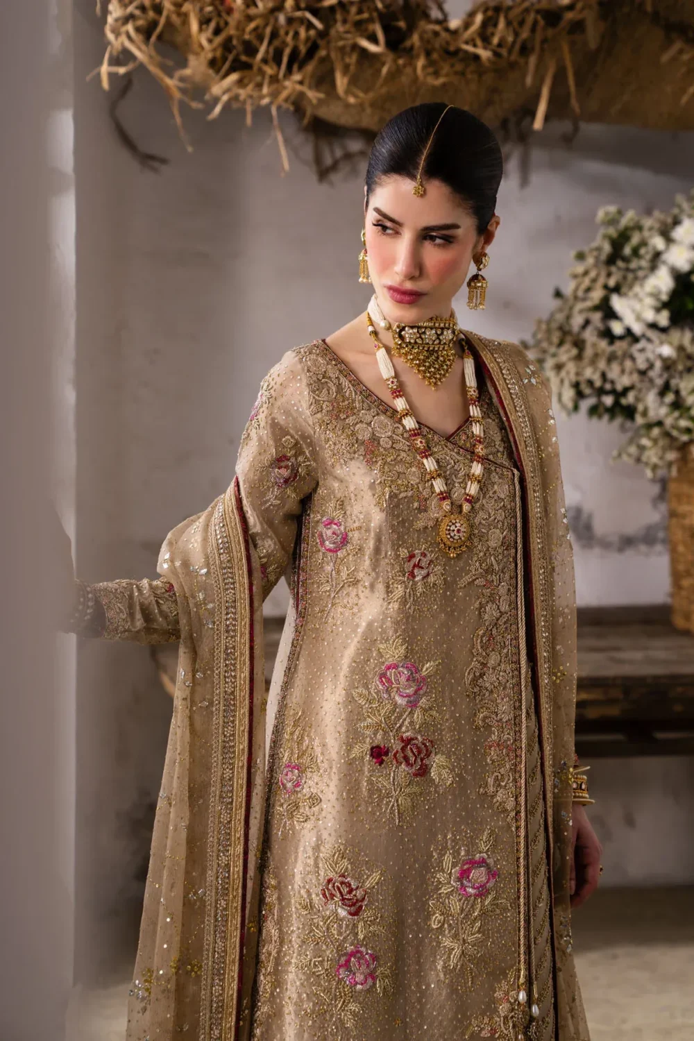 Styled portrait of gold organza angrakha suit with bridal jewelry - Hammad Bespoke Official