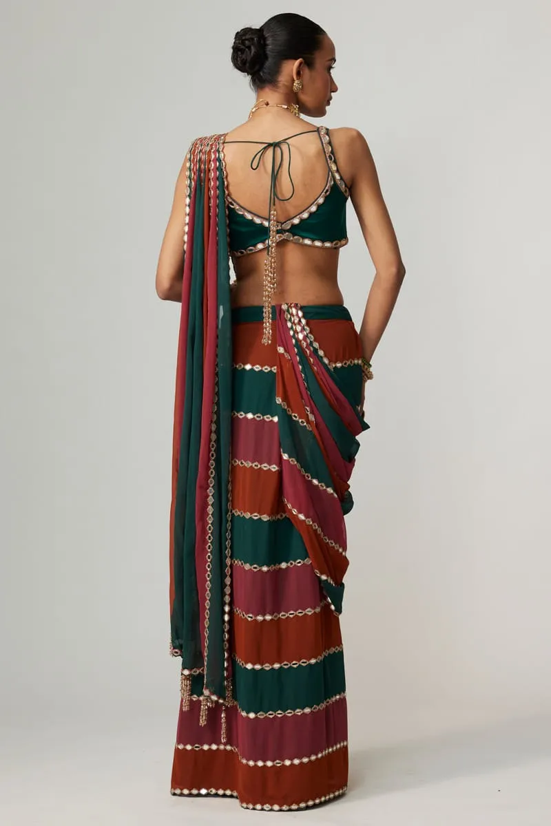 open-back-satin-blouse-mirror-work-saree-striped-georgette-teal-maroon-rust-hammad-bespoke-official.webp open-back satin blouse mirror work saree striped georgette teal maroon rust Hammad Bespoke Official